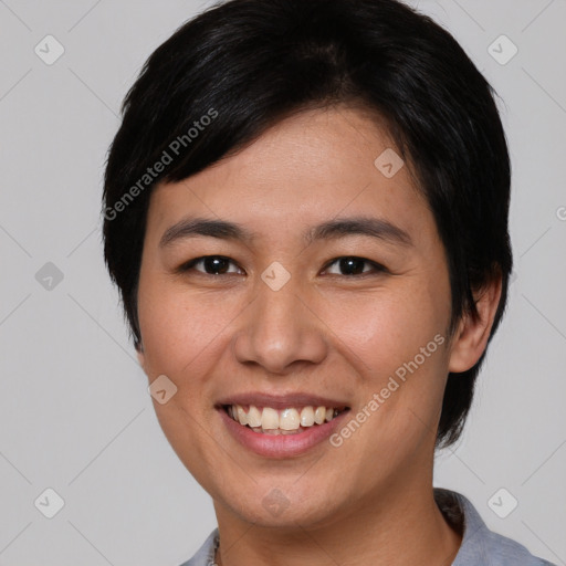 Joyful asian young-adult female with short  black hair and brown eyes