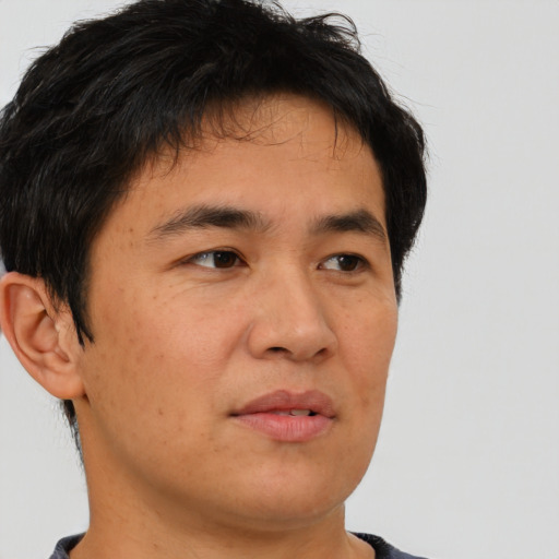 Neutral asian young-adult male with short  brown hair and brown eyes