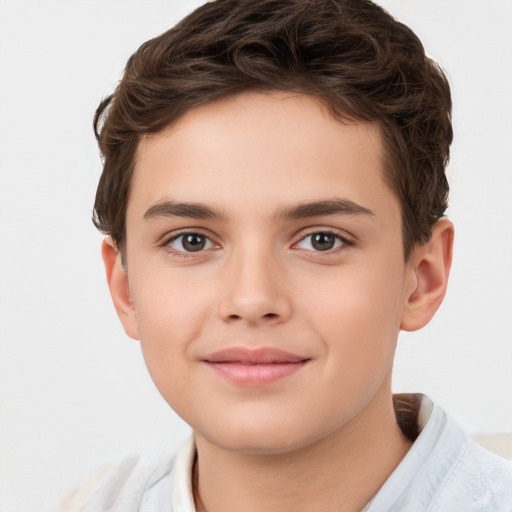 Joyful white child male with short  brown hair and brown eyes