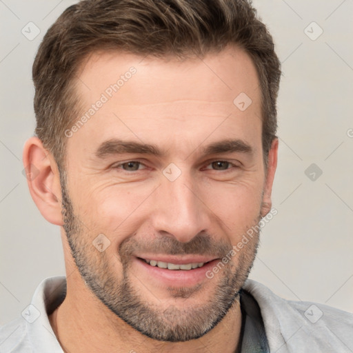 Joyful white adult male with short  brown hair and brown eyes