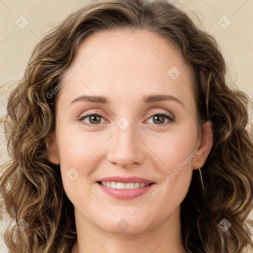 Joyful white young-adult female with long  brown hair and green eyes