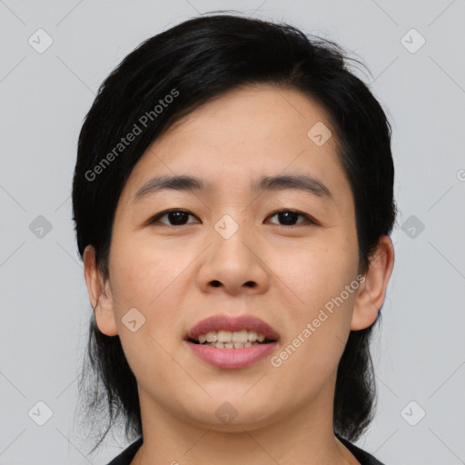 Joyful asian young-adult female with medium  black hair and brown eyes