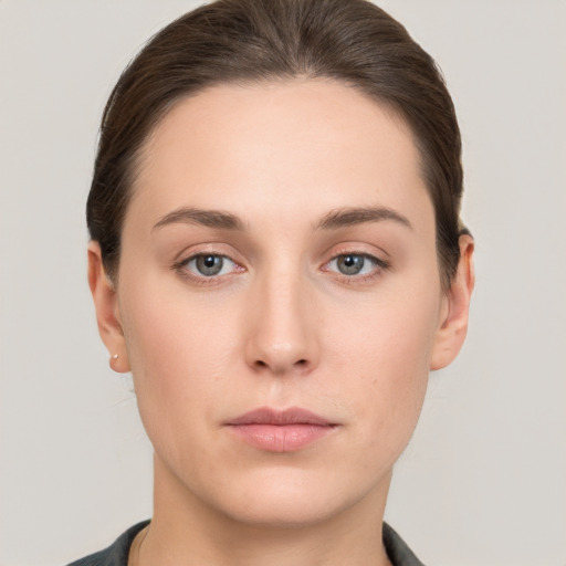 Neutral white young-adult female with short  brown hair and brown eyes