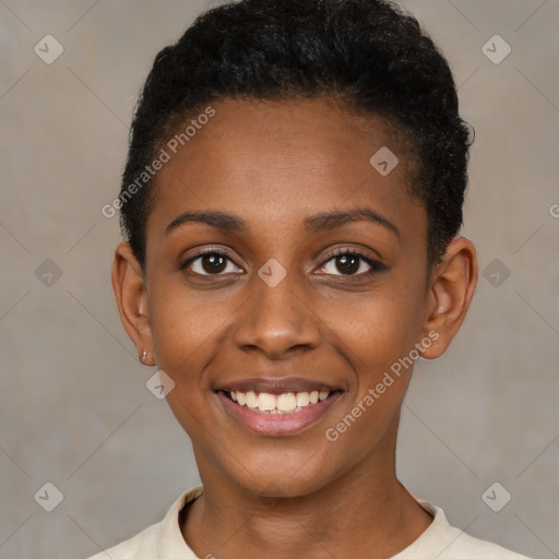 Joyful black young-adult female with short  brown hair and brown eyes