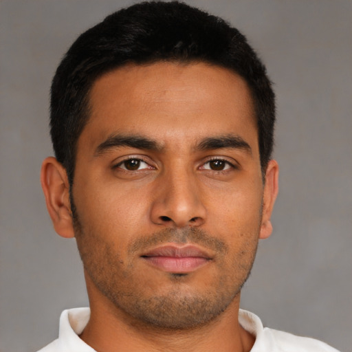 Neutral latino young-adult male with short  brown hair and brown eyes