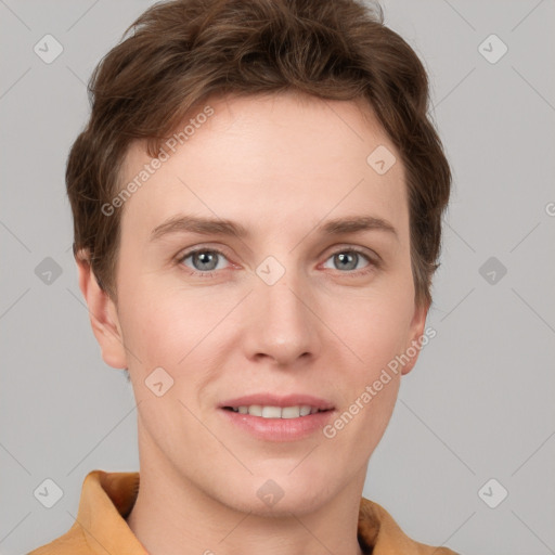 Joyful white young-adult female with short  brown hair and grey eyes