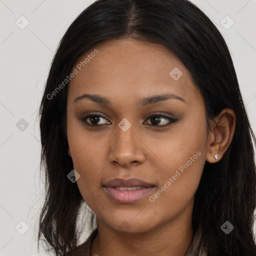 Joyful black young-adult female with long  brown hair and brown eyes