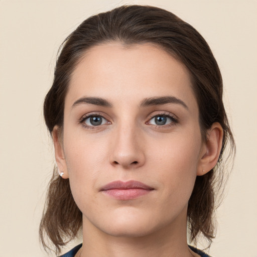 Neutral white young-adult female with medium  brown hair and brown eyes