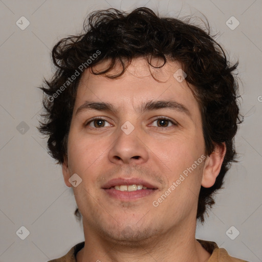 Joyful white young-adult male with medium  brown hair and brown eyes