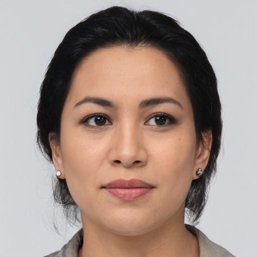 Joyful asian young-adult female with medium  brown hair and brown eyes