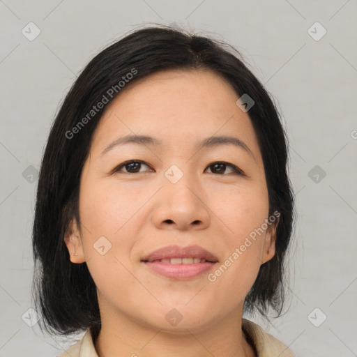 Joyful asian young-adult female with medium  brown hair and brown eyes