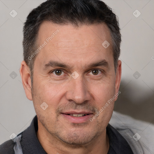 Joyful white adult male with short  brown hair and brown eyes