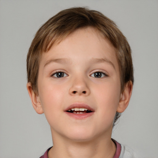 Joyful white child male with short  brown hair and brown eyes