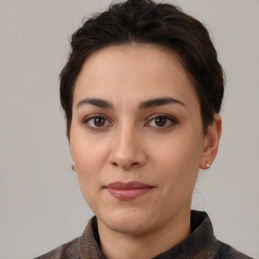 Joyful white young-adult female with short  brown hair and brown eyes