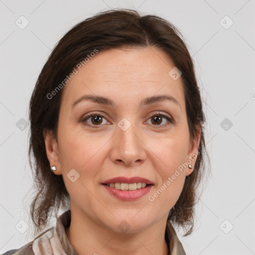 Joyful white adult female with medium  brown hair and brown eyes