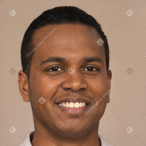 Joyful black young-adult male with short  brown hair and brown eyes