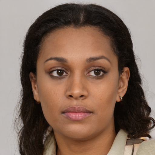 Neutral latino young-adult female with long  brown hair and brown eyes