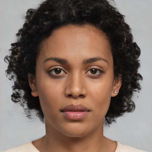 Neutral black young-adult female with medium  black hair and brown eyes