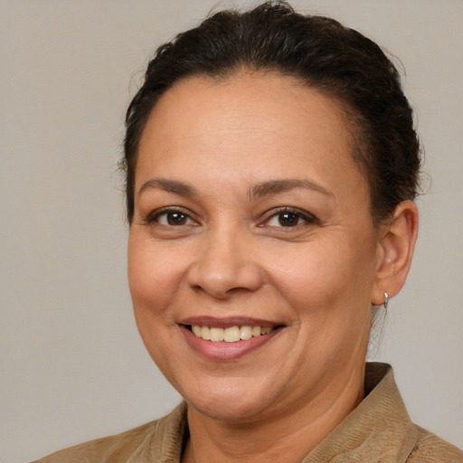 Joyful white adult female with short  brown hair and brown eyes