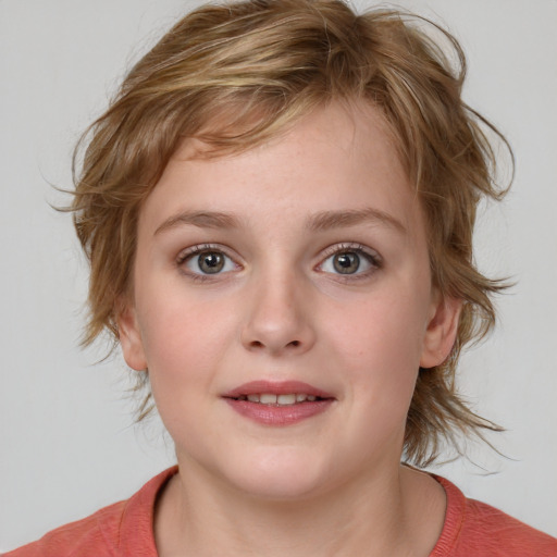 Joyful white child female with medium  brown hair and grey eyes