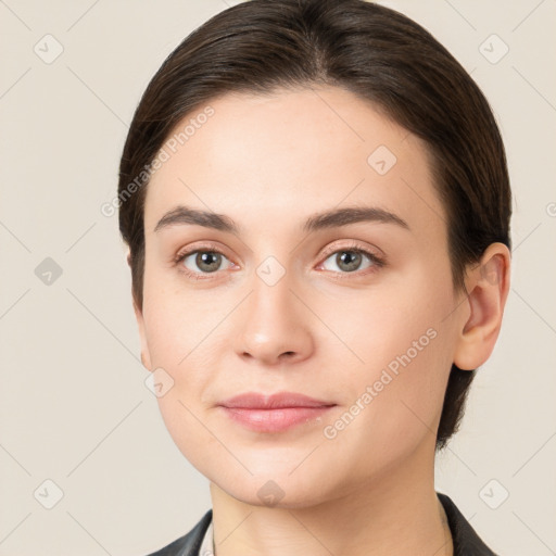 Neutral white young-adult female with medium  brown hair and brown eyes