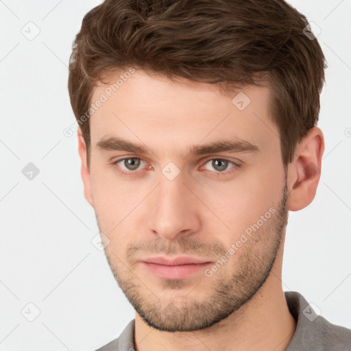 Neutral white young-adult male with short  brown hair and brown eyes