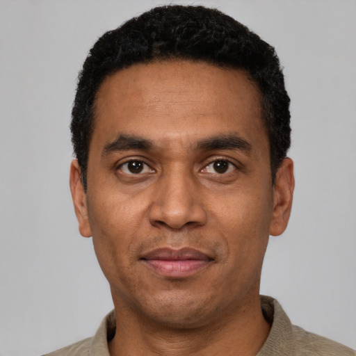 Neutral latino adult male with short  black hair and brown eyes