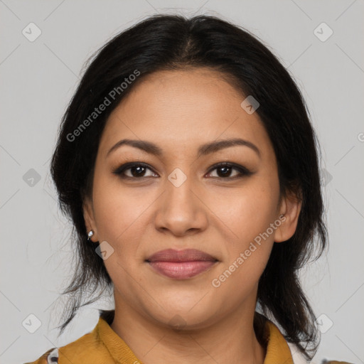 Joyful latino young-adult female with medium  brown hair and brown eyes