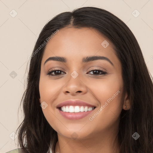 Joyful latino young-adult female with long  black hair and brown eyes