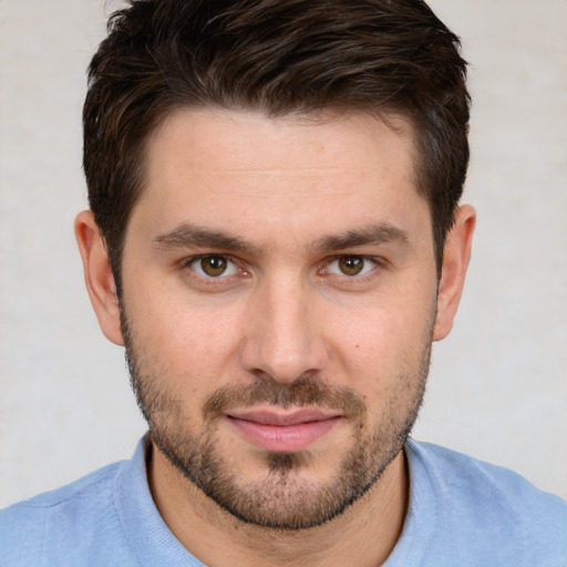 Joyful white young-adult male with short  brown hair and brown eyes