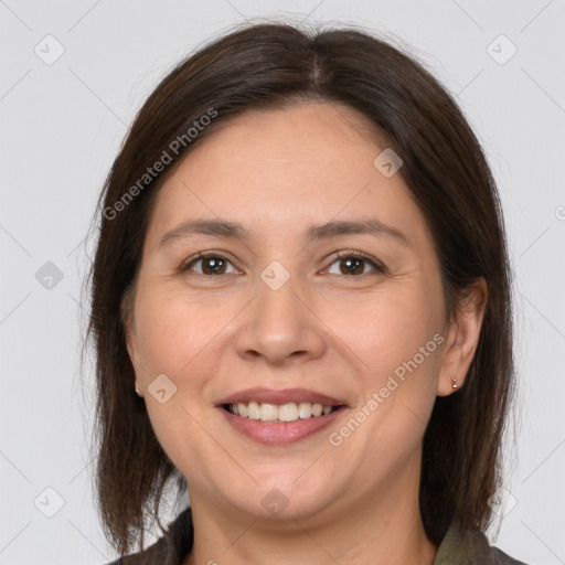 Joyful white adult female with medium  brown hair and brown eyes