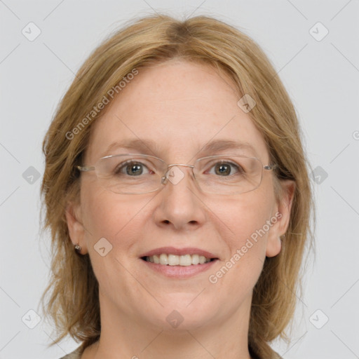 Joyful white adult female with medium  brown hair and grey eyes