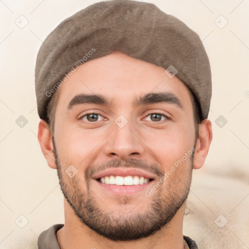 Joyful white young-adult male with short  black hair and brown eyes