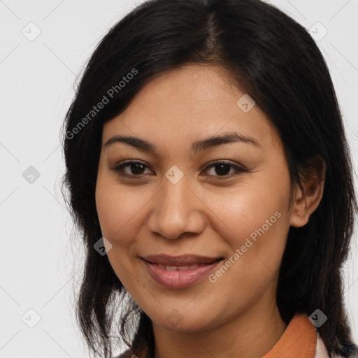 Joyful latino young-adult female with long  brown hair and brown eyes