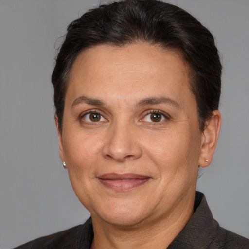 Joyful white adult female with short  brown hair and brown eyes