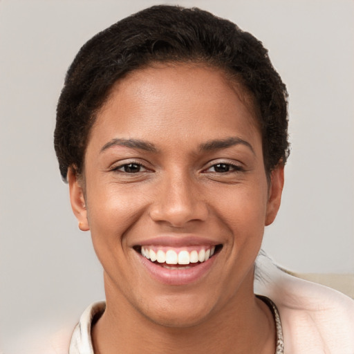 Joyful white young-adult female with short  brown hair and brown eyes