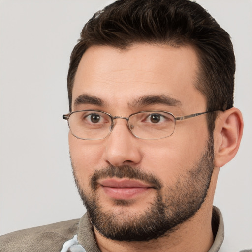 Joyful white adult male with short  brown hair and brown eyes