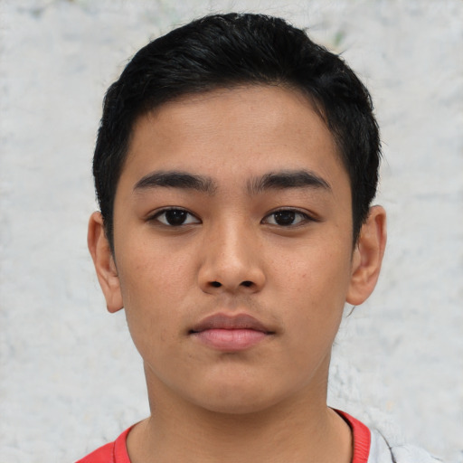 Neutral latino child male with short  black hair and brown eyes