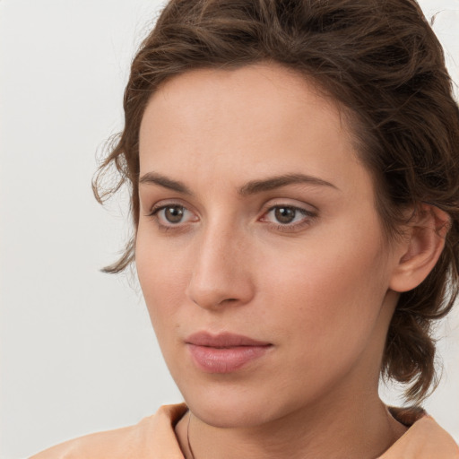 Neutral white young-adult female with medium  brown hair and brown eyes