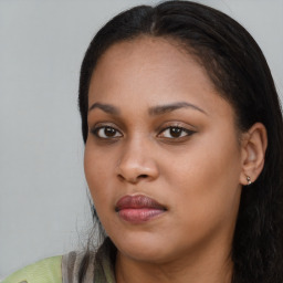 Joyful black young-adult female with long  brown hair and brown eyes