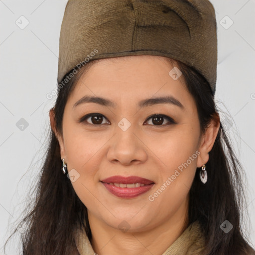 Joyful latino young-adult female with medium  brown hair and brown eyes