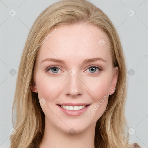 Joyful white young-adult female with long  brown hair and blue eyes