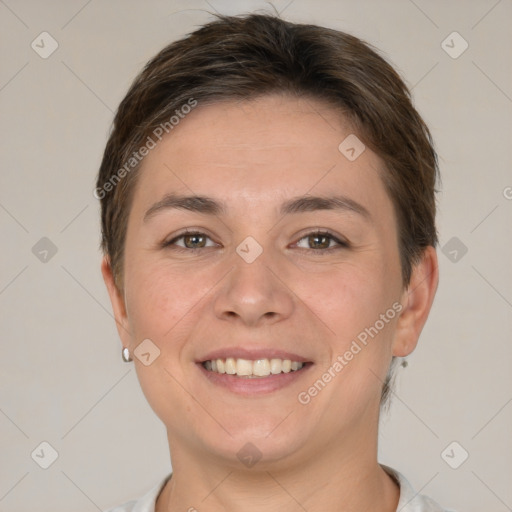 Joyful white young-adult female with short  brown hair and grey eyes