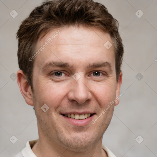 Joyful white adult male with short  brown hair and grey eyes