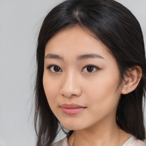 Neutral asian young-adult female with medium  brown hair and brown eyes