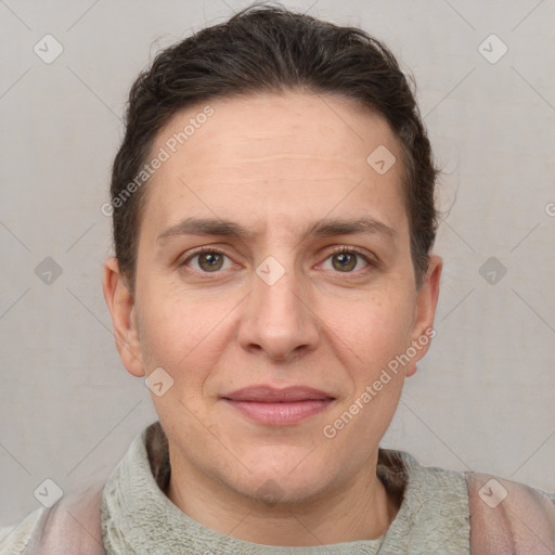 Joyful white adult female with short  brown hair and brown eyes