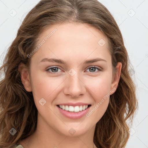 Joyful white young-adult female with long  brown hair and green eyes