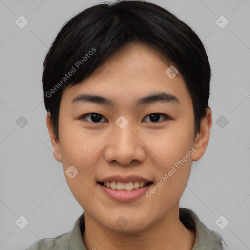 Joyful asian young-adult female with short  black hair and brown eyes