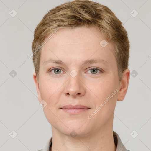 Joyful white young-adult female with short  brown hair and grey eyes