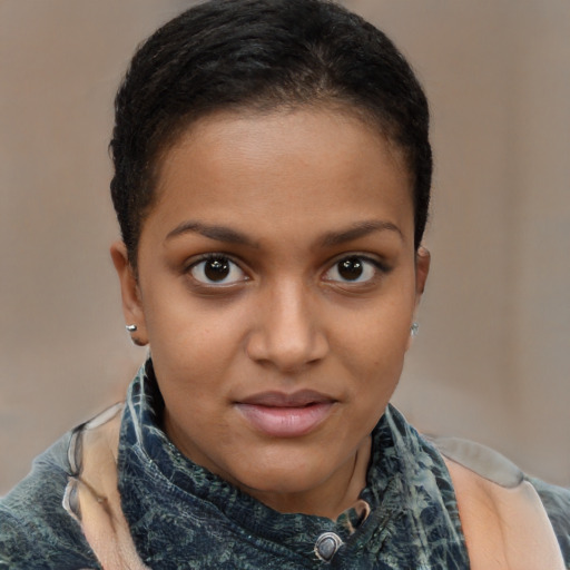 Joyful black child female with short  brown hair and brown eyes
